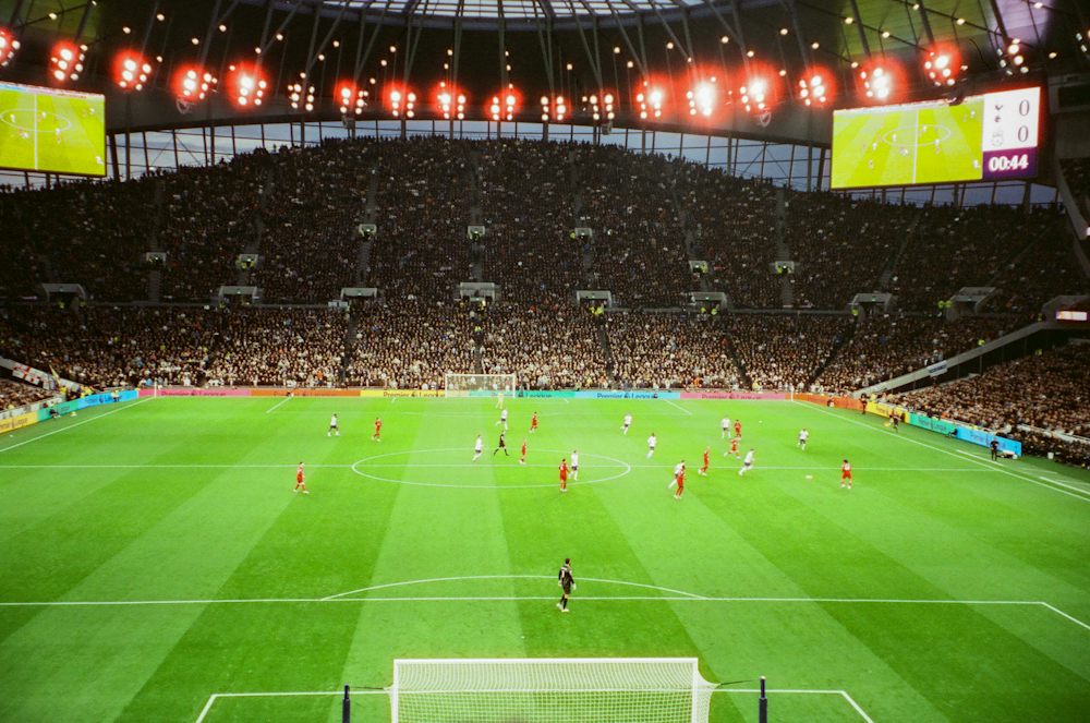 Football match in a floodlit stadium